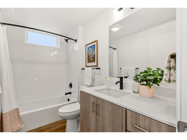 a bathroom with a sink vanity granite and a mirror