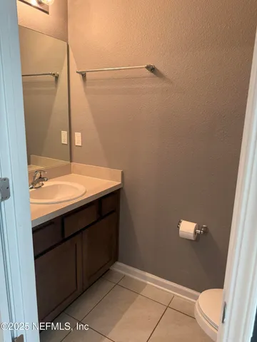 a bathroom with a sink a toilet and vanity