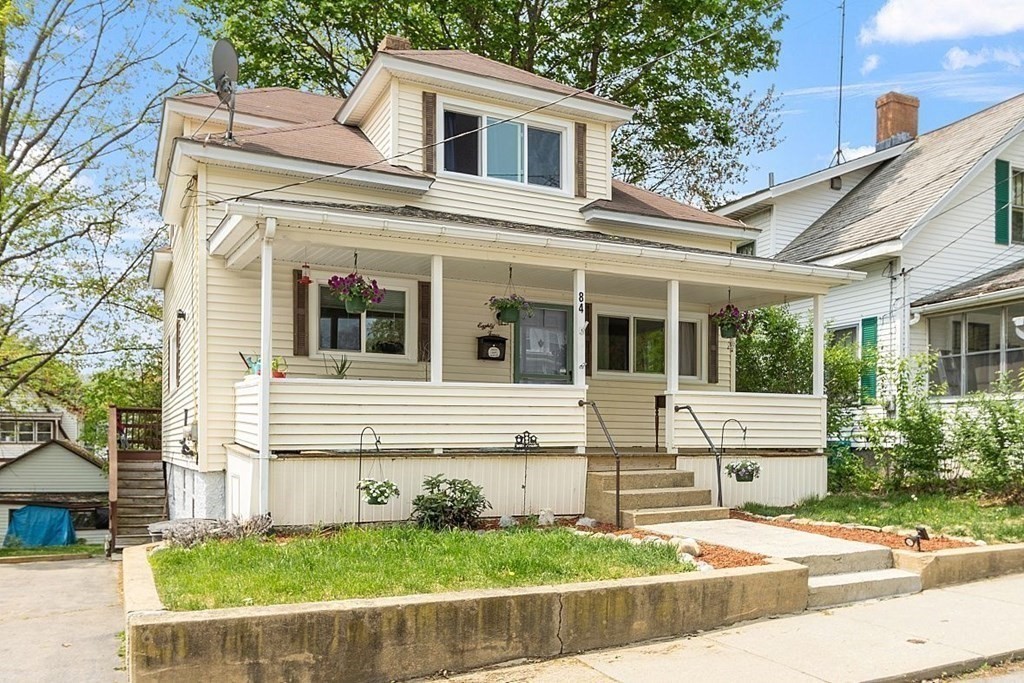 84 Euclid Street Gardner, MA 01440 - Photo 1 of 28 a front view of a house with a yard and garage