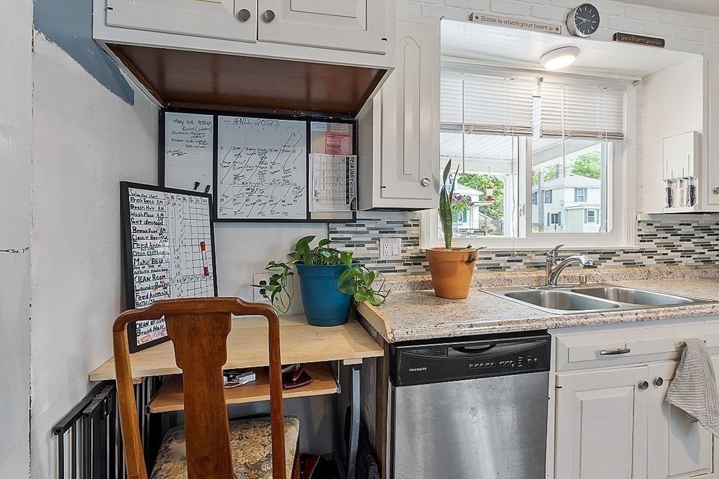 84 Euclid Street Gardner, MA 01440 - Photo 11 of 28 a kitchen with a table chairs and a window