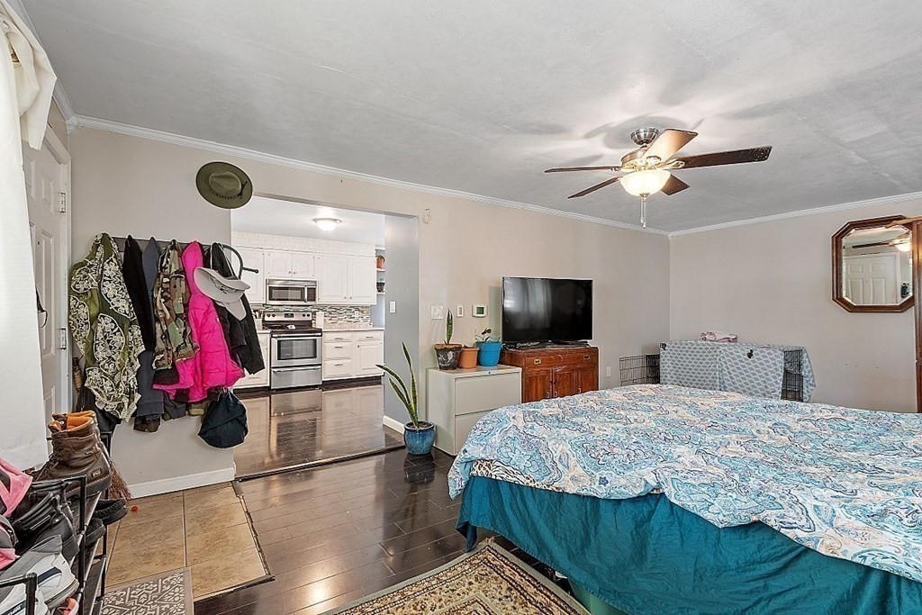 84 Euclid Street Gardner, MA 01440 - Photo 16 of 28 a living room with furniture and a flat screen tv