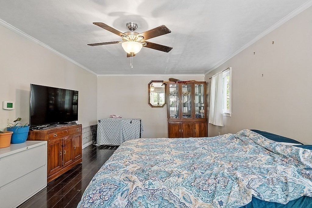 84 Euclid Street Gardner, MA 01440 - Photo 17 of 28 a bedroom with a bed and a flat screen tv