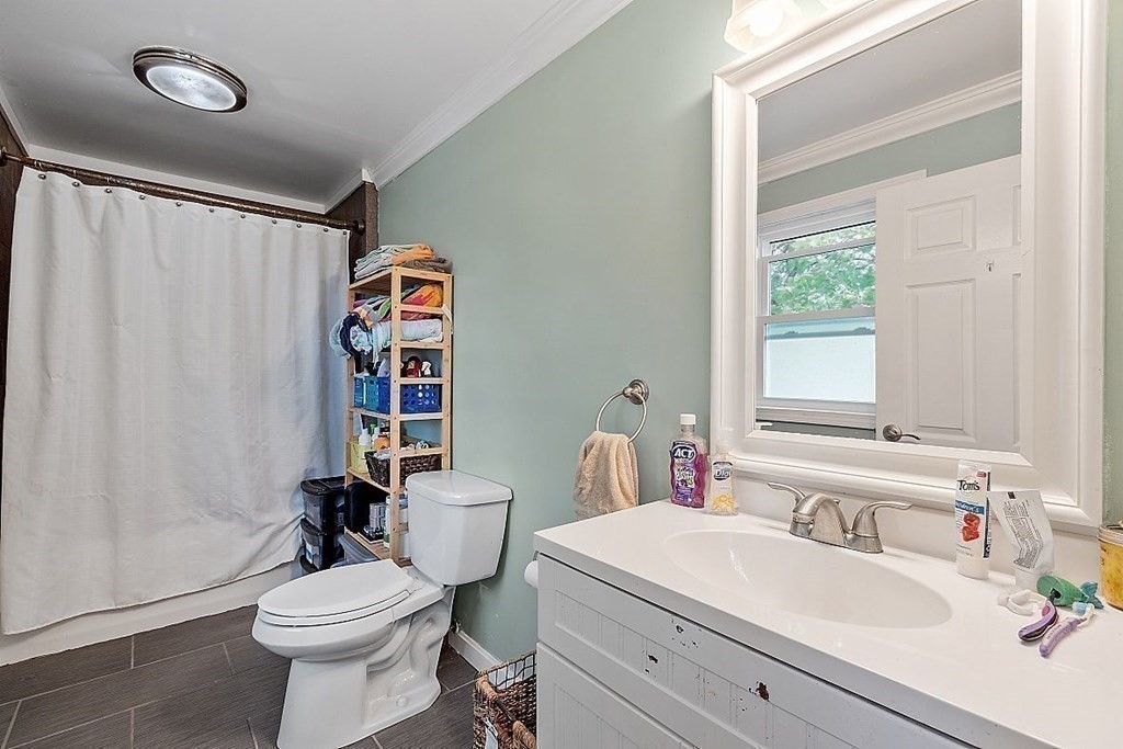 84 Euclid Street Gardner, MA 01440 - Photo 18 of 28 a bathroom with a sink a toilet and a mirror