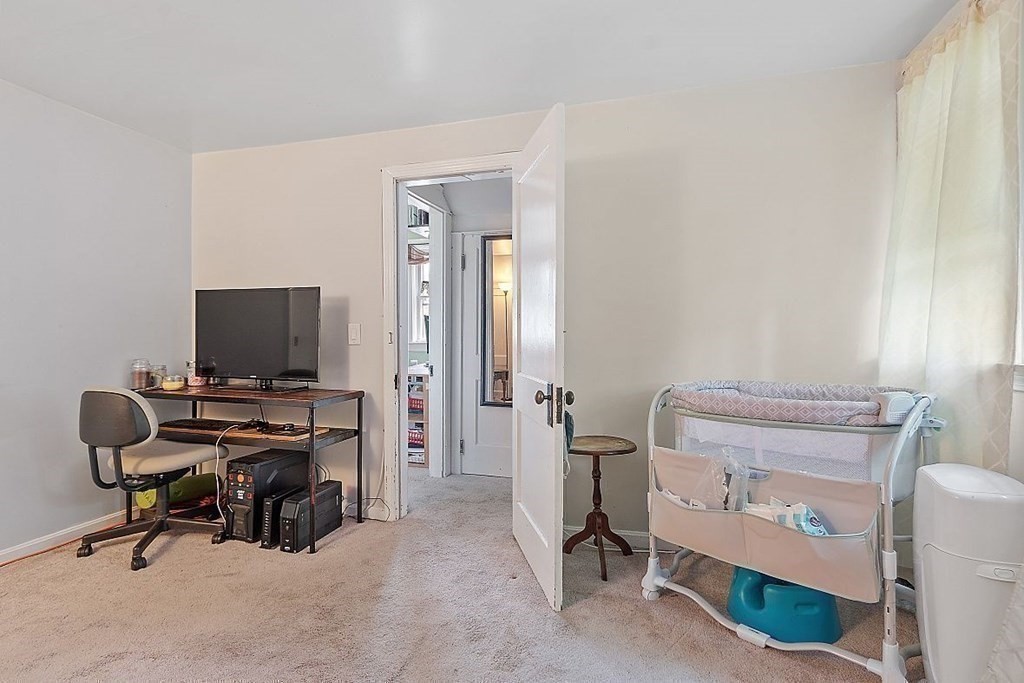 84 Euclid Street Gardner, MA 01440 - Photo 20 of 28 a view of a workspace with furniture and a window