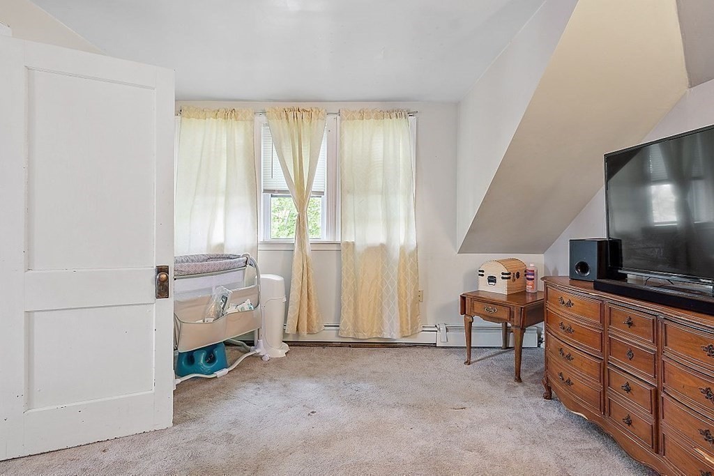 84 Euclid Street Gardner, MA 01440 - Photo 21 of 28 a room with furniture and a flat screen tv