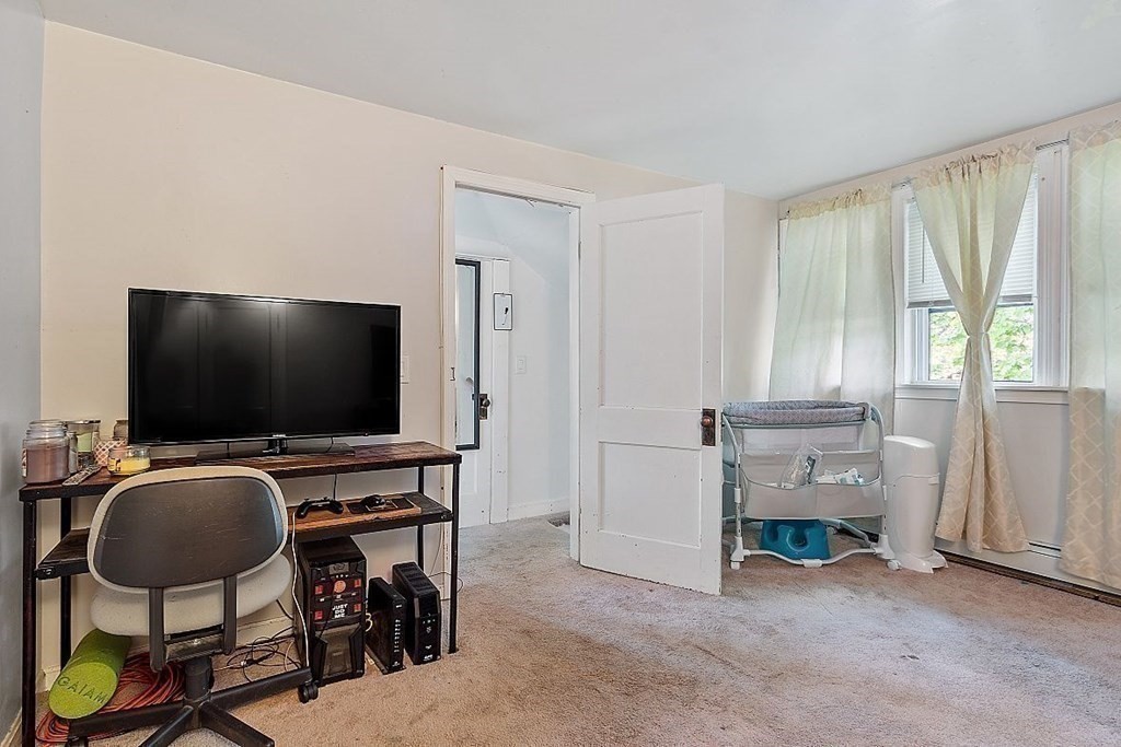 84 Euclid Street Gardner, MA 01440 - Photo 22 of 28 a view of a livingroom with furniture and a flat screen tv