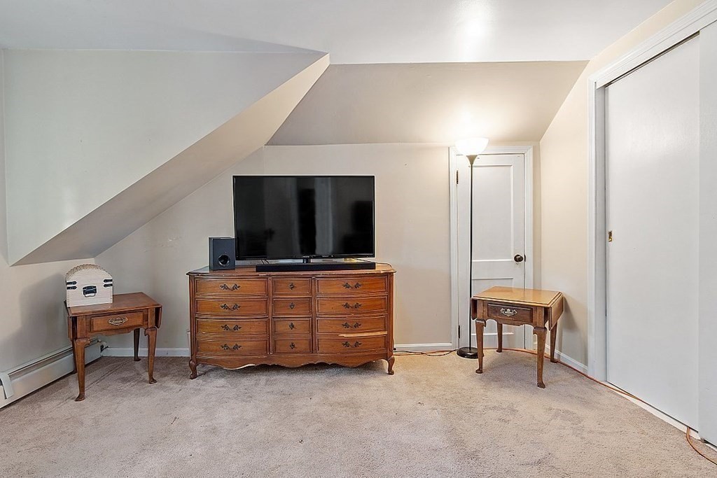 84 Euclid Street Gardner, MA 01440 - Photo 23 of 28 a living room with furniture and a flat screen tv