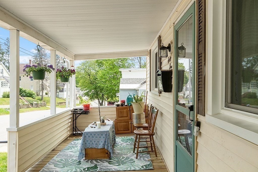 84 Euclid Street Gardner, MA 01440 - Photo 4 of 28 a living room with furniture and a floor to ceiling window