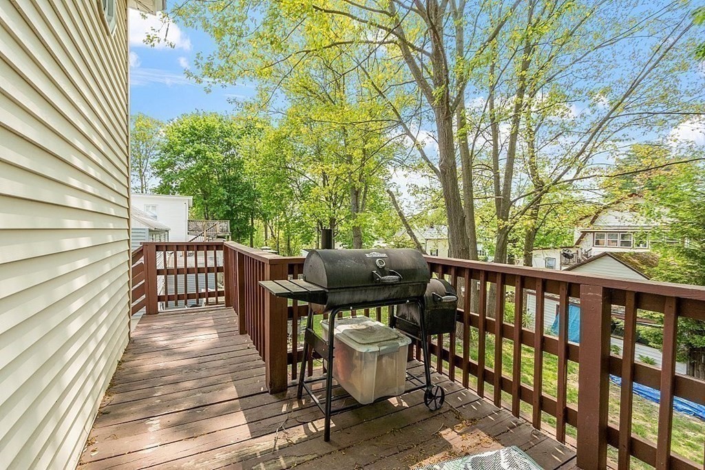 84 Euclid Street Gardner, MA 01440 - Photo 6 of 28 a view of a patio with table and chairs and wooden floor