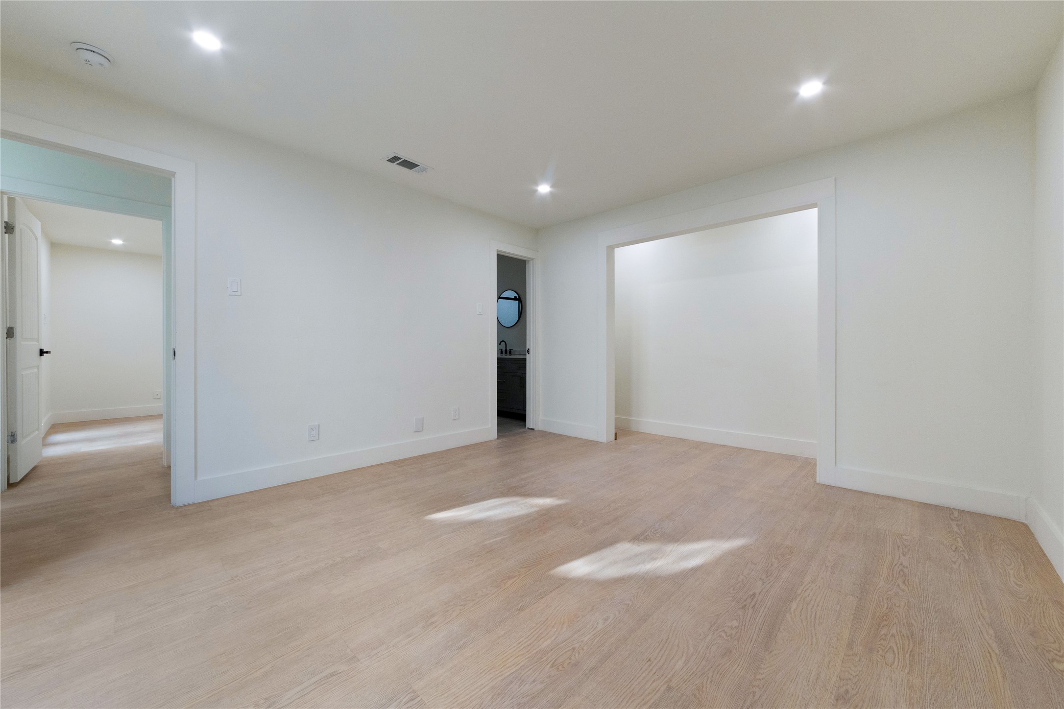 8807 Merion Circle Austin, TX 78754 - Photo 12 of 18 Blonde wood flooring extends throughout this versatile living space, ready for your personalized touch.