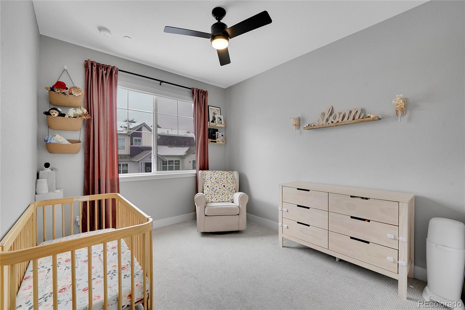 6211 West 28th Avenue Wheat Ridge, CO 80214 - Photo 18 of 29 a living room with furniture and a window