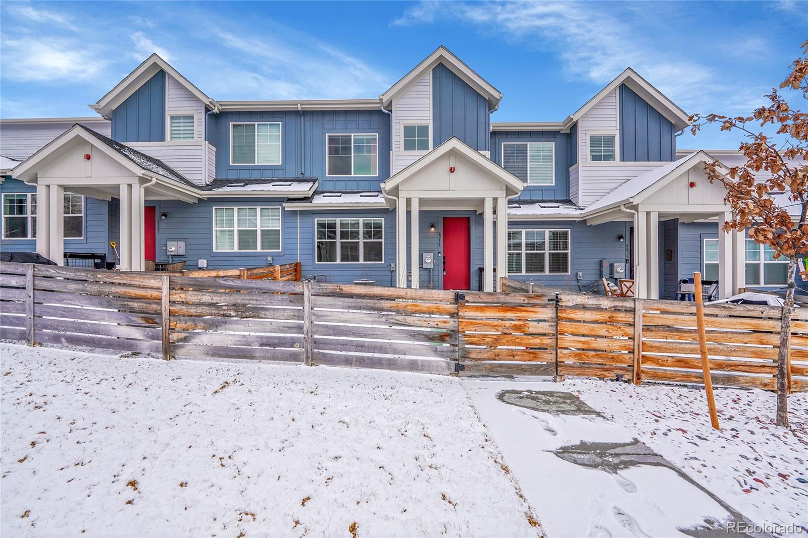 6211 West 28th Avenue Wheat Ridge, CO 80214 - Photo 2 of 29 a front view of a house with a yard