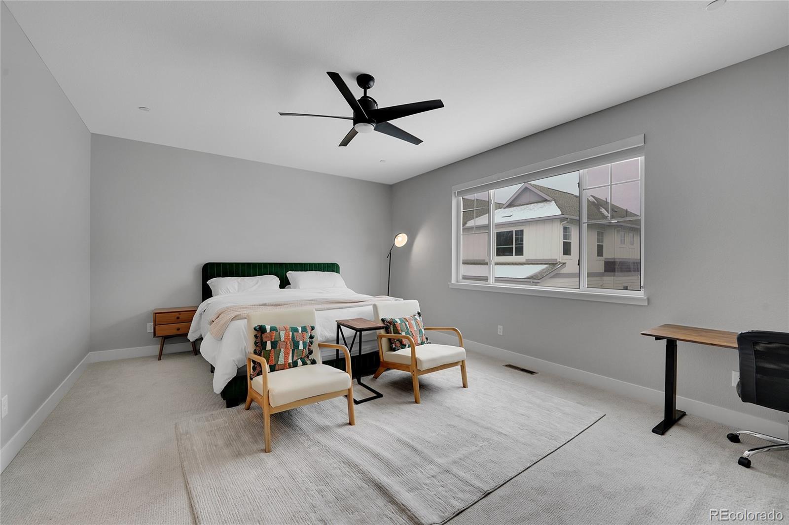 6211 West 28th Avenue Wheat Ridge, CO 80214 - Photo 21 of 29 a bedroom with a bed and window