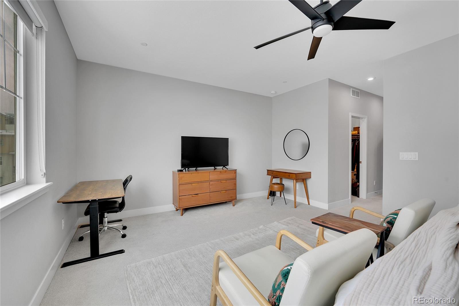 6211 West 28th Avenue Wheat Ridge, CO 80214 - Photo 23 of 29 a living room with furniture and a flat screen tv