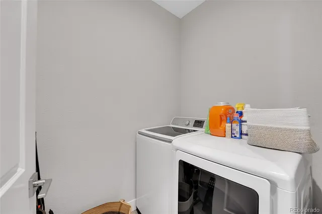 a close view of sink with washer and dryer