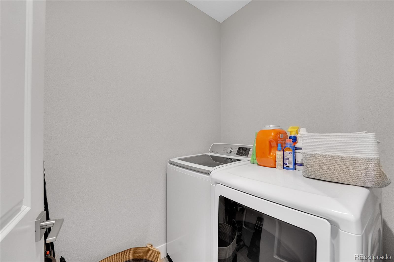 6211 West 28th Avenue Wheat Ridge, CO 80214 - Photo 27 of 29 a close view of sink with washer and dryer
