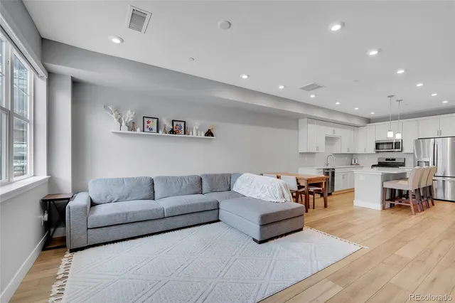 a living room with furniture and a table