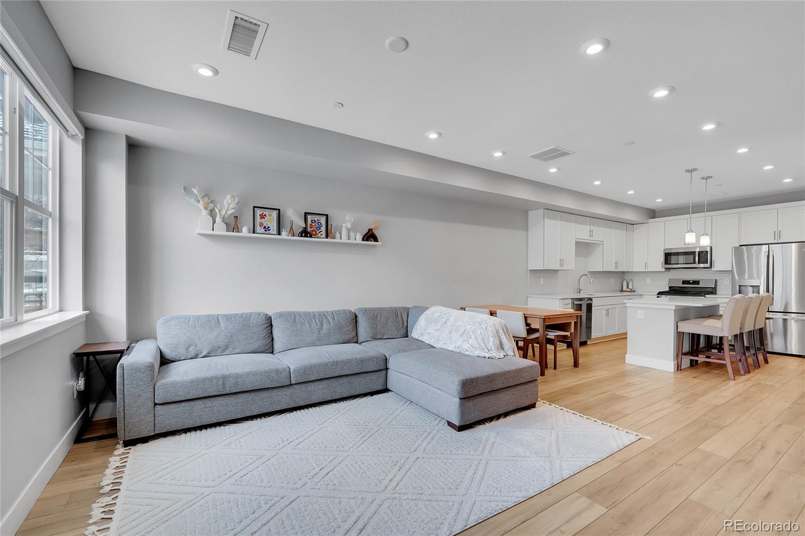 6211 West 28th Avenue Wheat Ridge, CO 80214 - Photo 7 of 29 a living room with furniture and a table