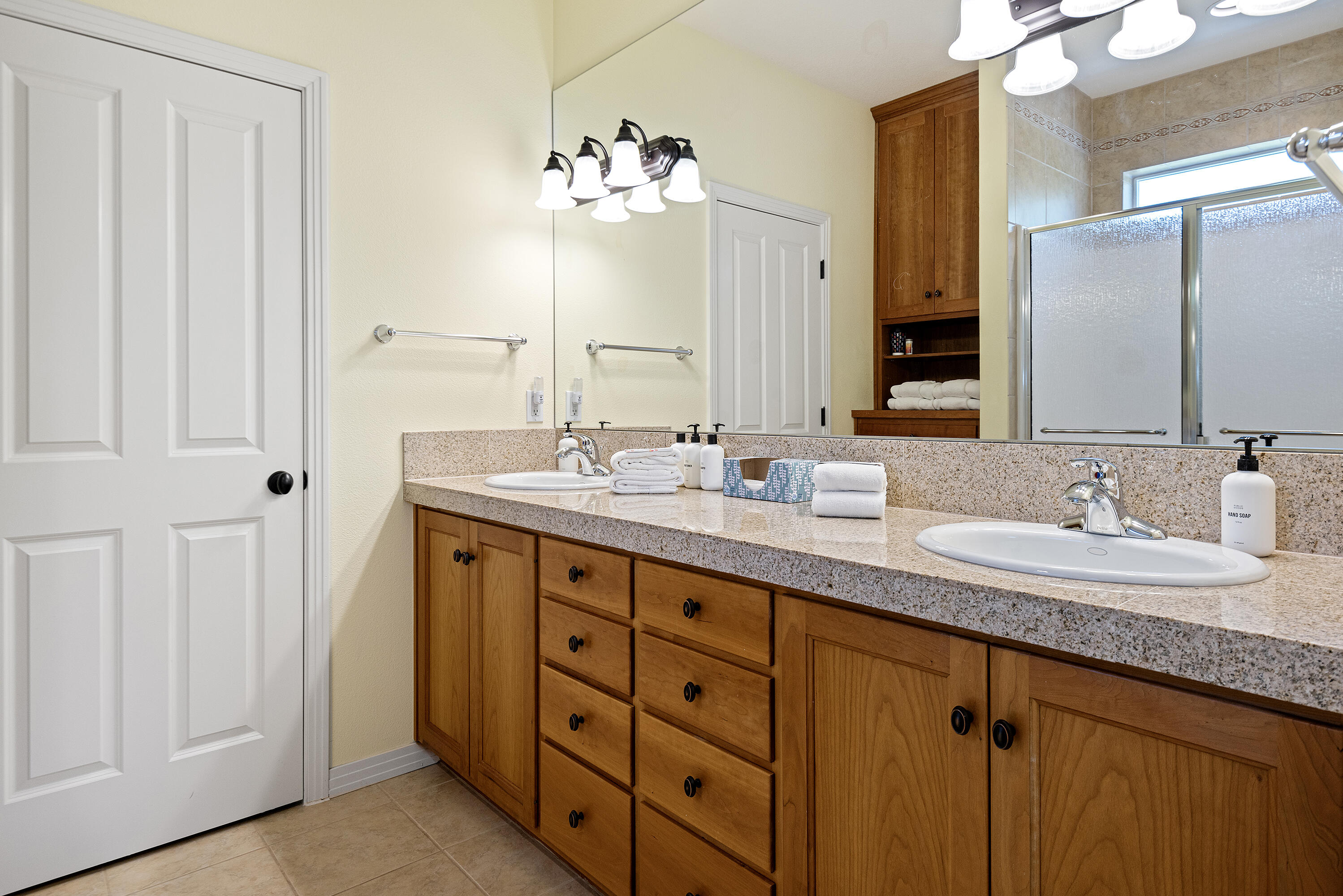 16775 Pony Express Way Bend, OR 97707 - Photo 13 of 38 a bathroom with double sink and a mirror
