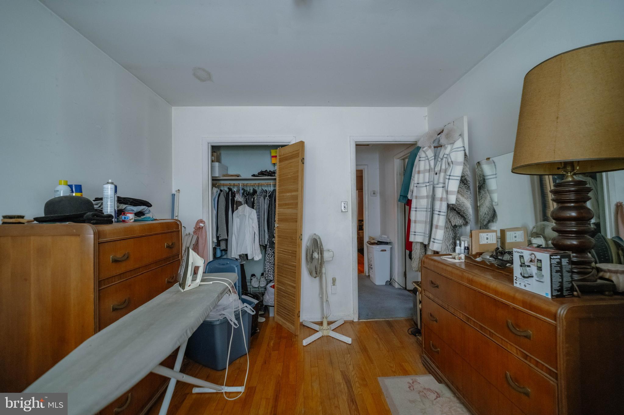 6900 Temple Hill Road Temple Hills, MD 20748 - Photo 38 of 43 a bed room with a bed and a lamp