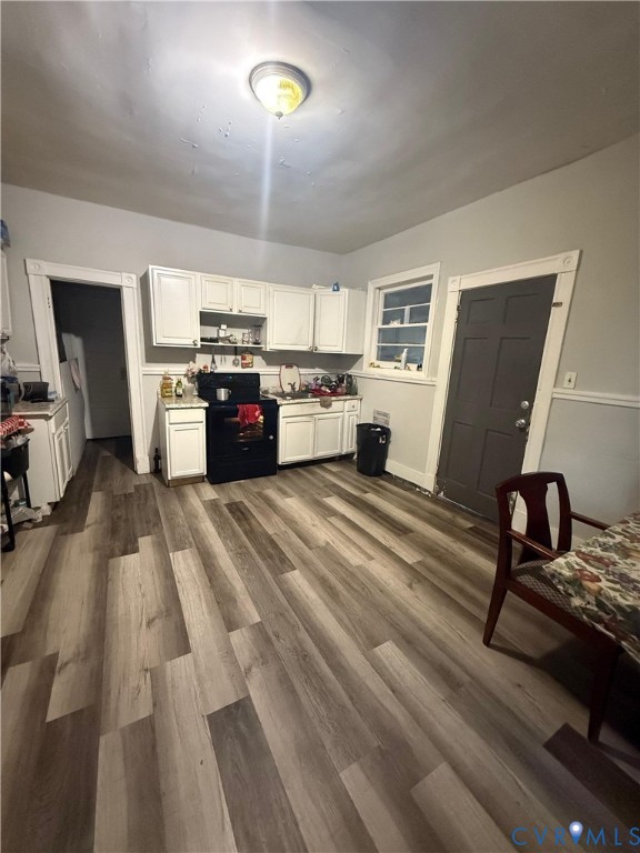 2714 Alexander Avenue Richmond, VA 23234 - Photo 3 of 15 a living room with furniture and a wooden floor