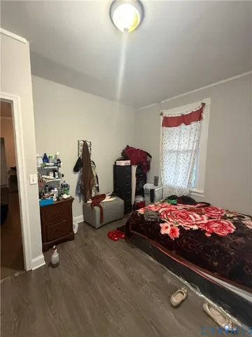 a bedroom with bed and window