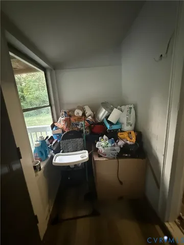 a view of living room with furniture and a window