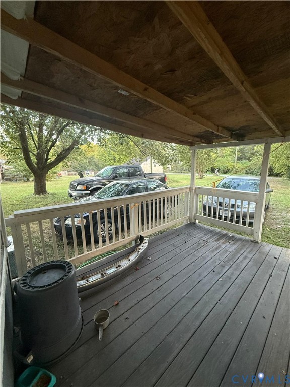 2714 Alexander Avenue Richmond, VA 23234 - Photo 10 of 15 a view of deck with furniture and trees in the background