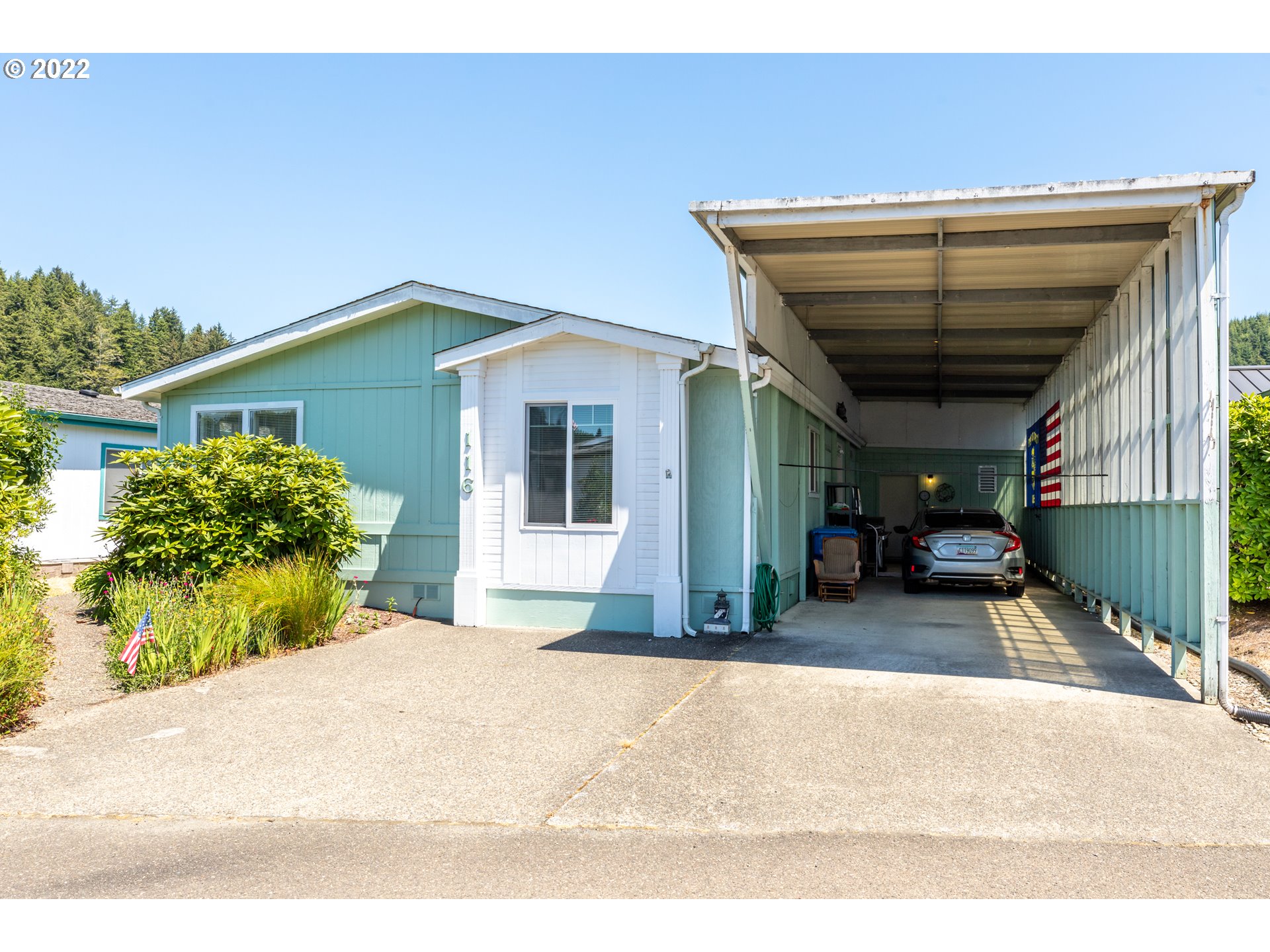 100 River Bend Road, Unit 116 Reedsport, OR 97467 - Photo 1 of 32 a house view with a outdoor space