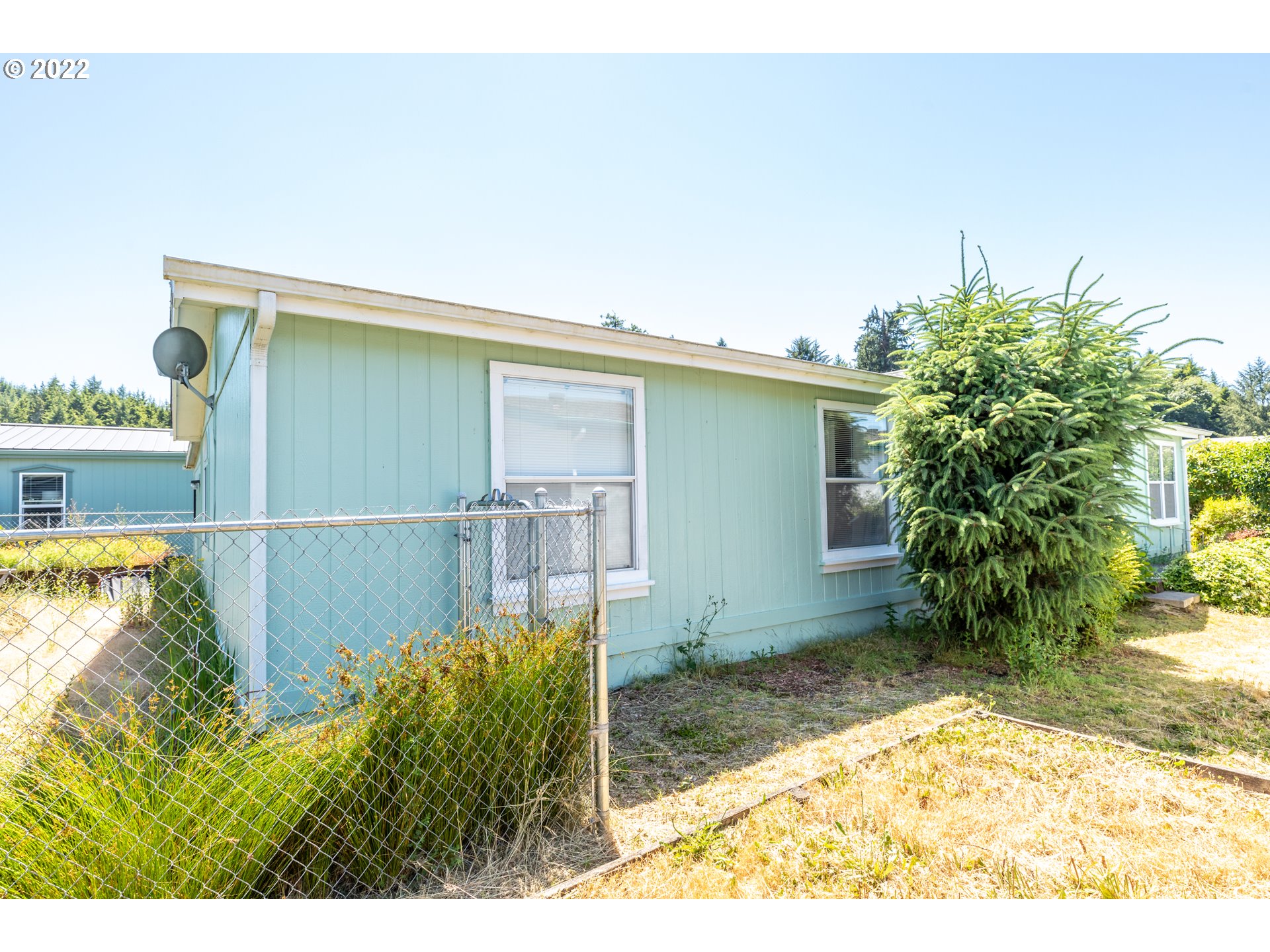100 River Bend Road, Unit 116 Reedsport, OR 97467 - Photo 11 of 32 a view of outdoor space and yard