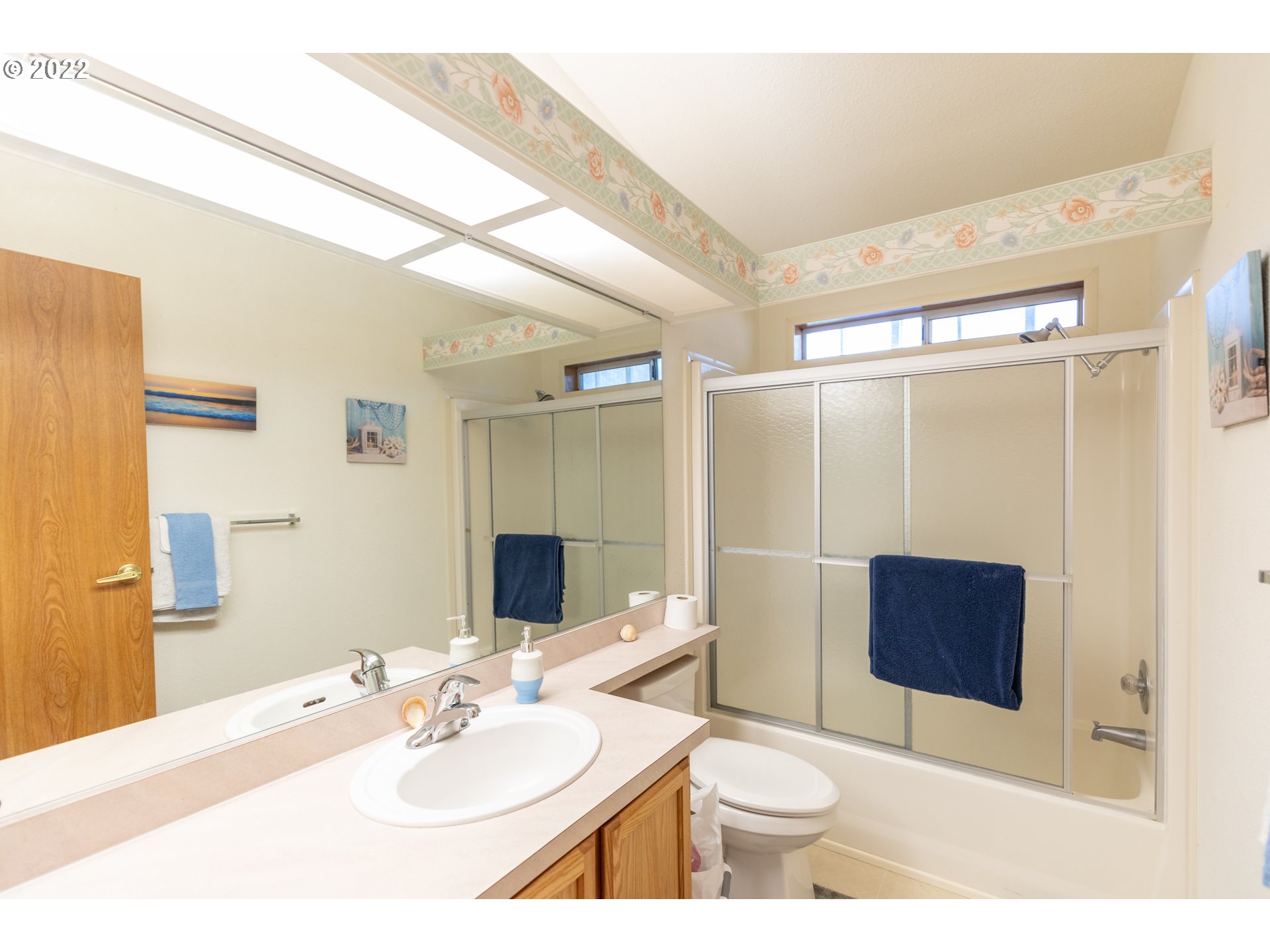 100 River Bend Road, Unit 116 Reedsport, OR 97467 - Photo 23 of 32 a bathroom with a sink and a mirror