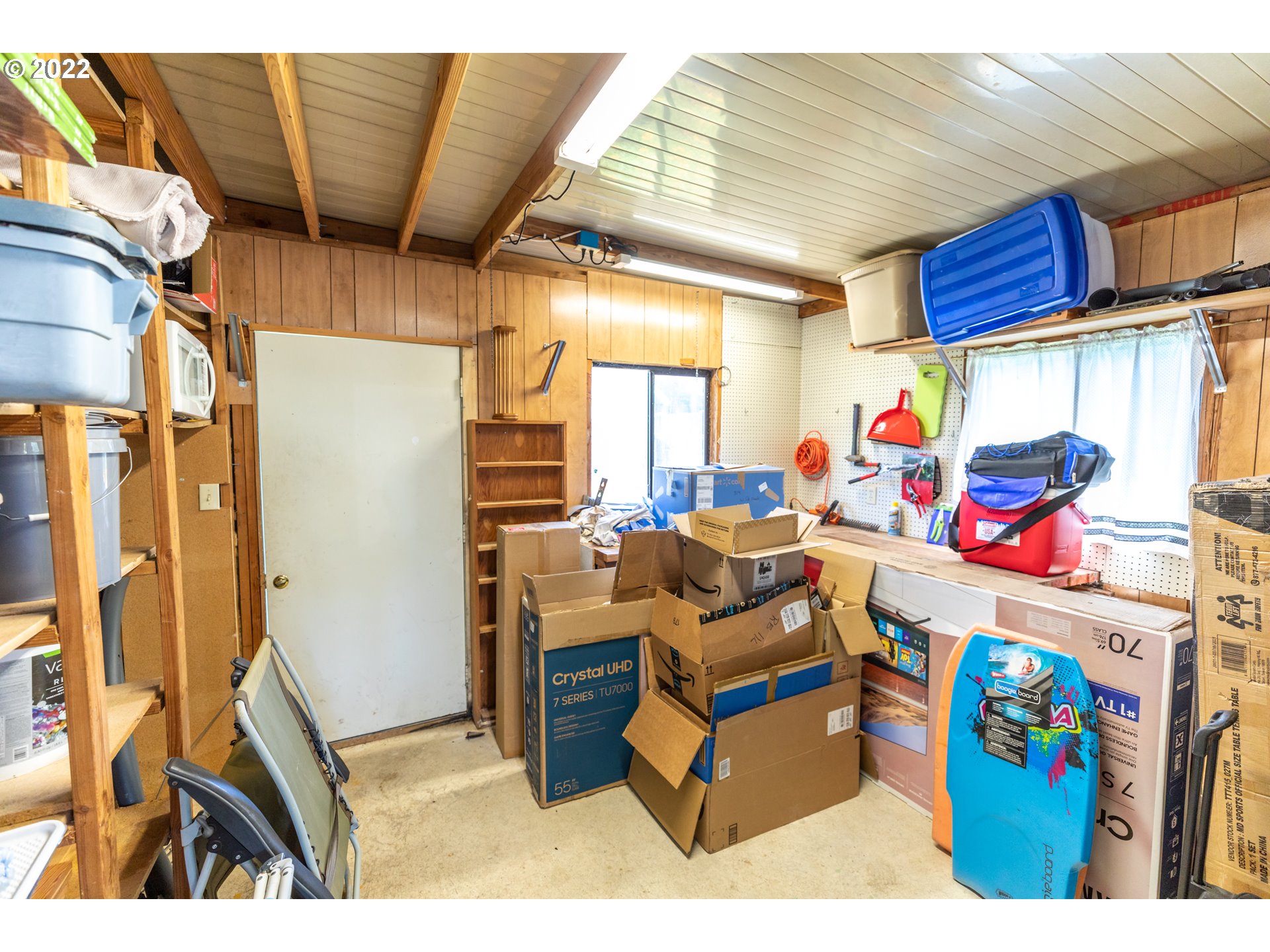 100 River Bend Road, Unit 116 Reedsport, OR 97467 - Photo 8 of 32 a room with furniture and a garage