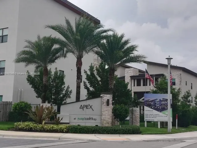 a front view of a house with tree s