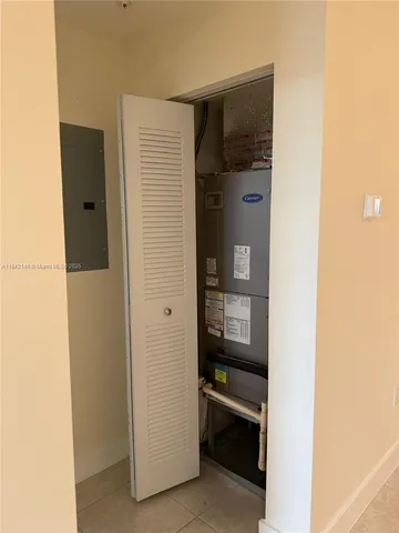 a view of bathroom with a wardrobe door