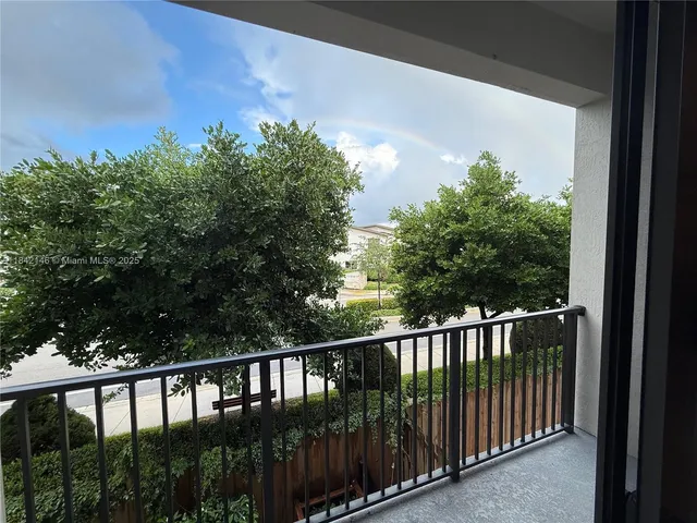 a view of a balcony with a pot
