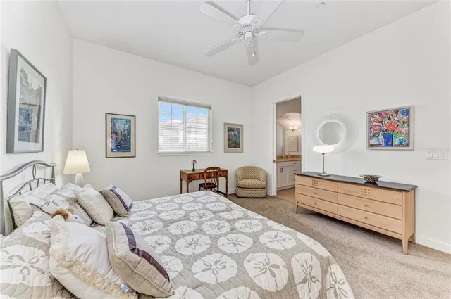 a bedroom with bed and window