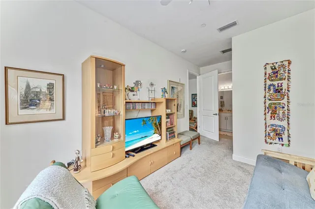 a living room with furniture gym equipment and a table