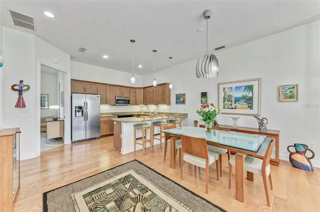 a view of a kitchen and dining room