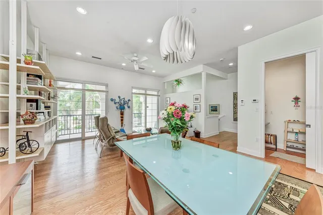a view of a dining room with furniture and a chandelier