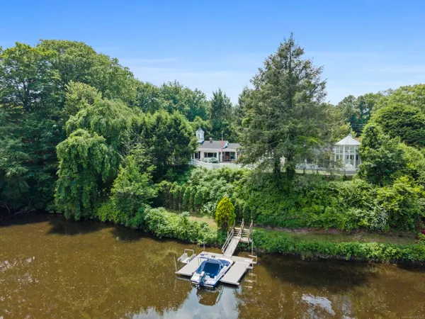 a view of a lake with a house in the background