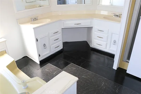 a utility room with a sink a washer and dryer