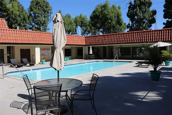 a view of a house with backyard porch and sitting area