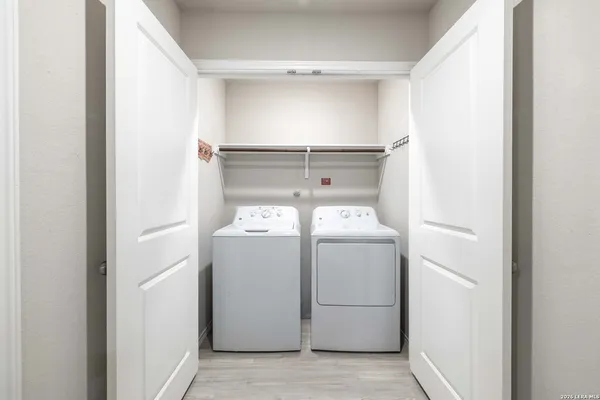 a utility room with dryer and washer