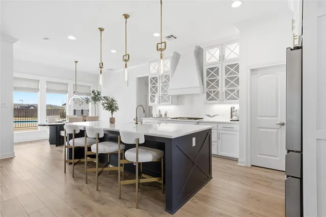 a view of dining table chairs and chandelier