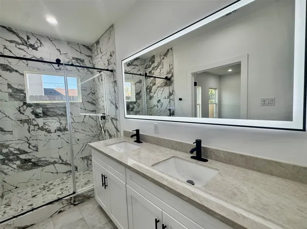 a bathroom with a sink and a mirror