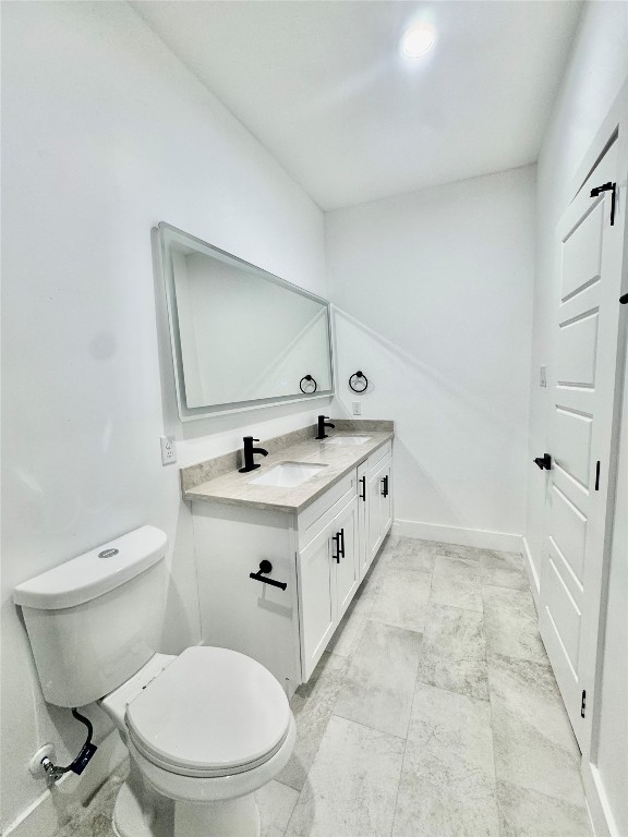 6926 Paris Street, Unit B Houston, TX 77021 - Photo 8 of 20 a spacious bathroom with a granite countertop toilet sink and mirror