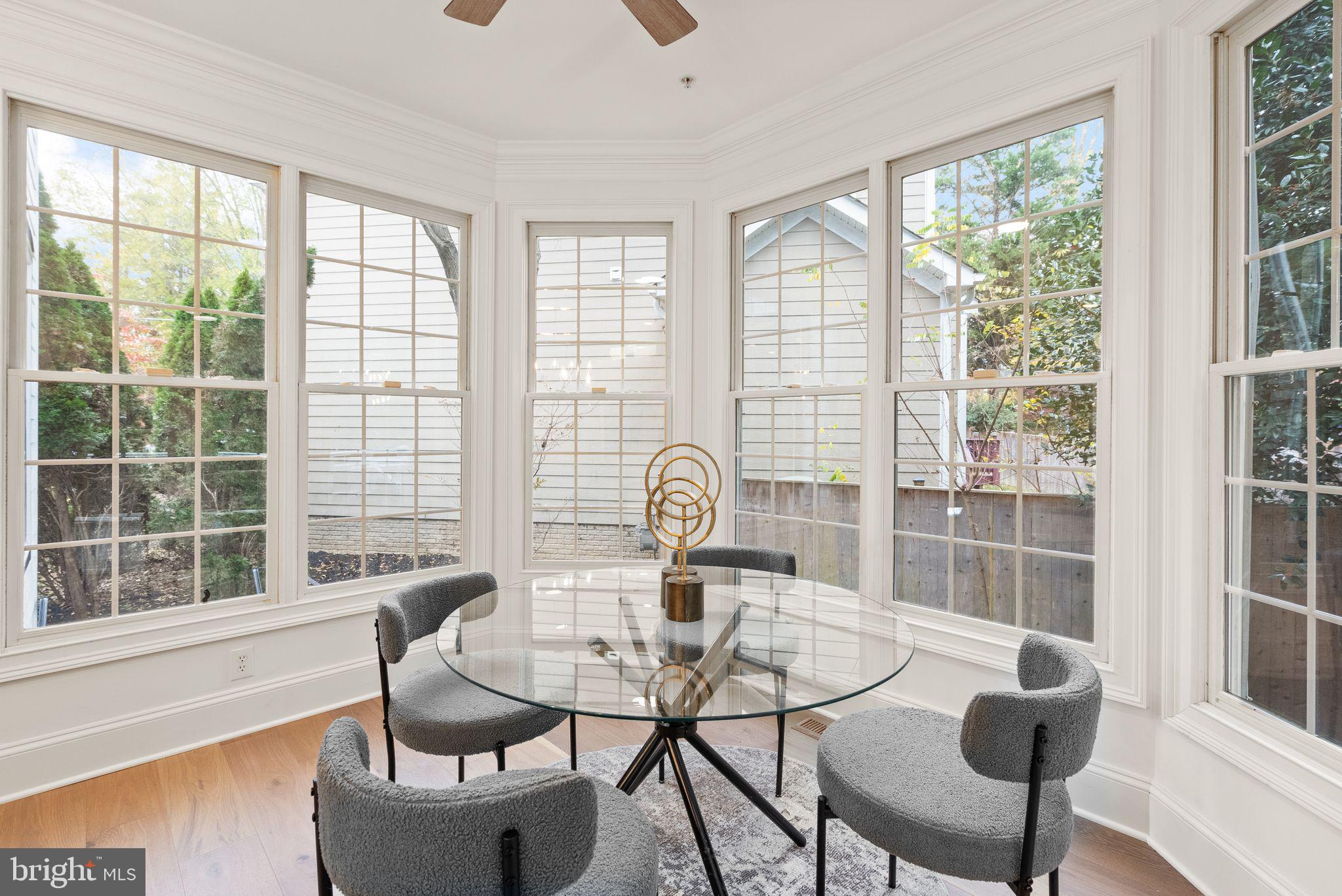 3336 Jones Bridge Court Chevy Chase, MD 20815 - Photo 30 of 99 a view of a dining room with furniture wooden floor and windows