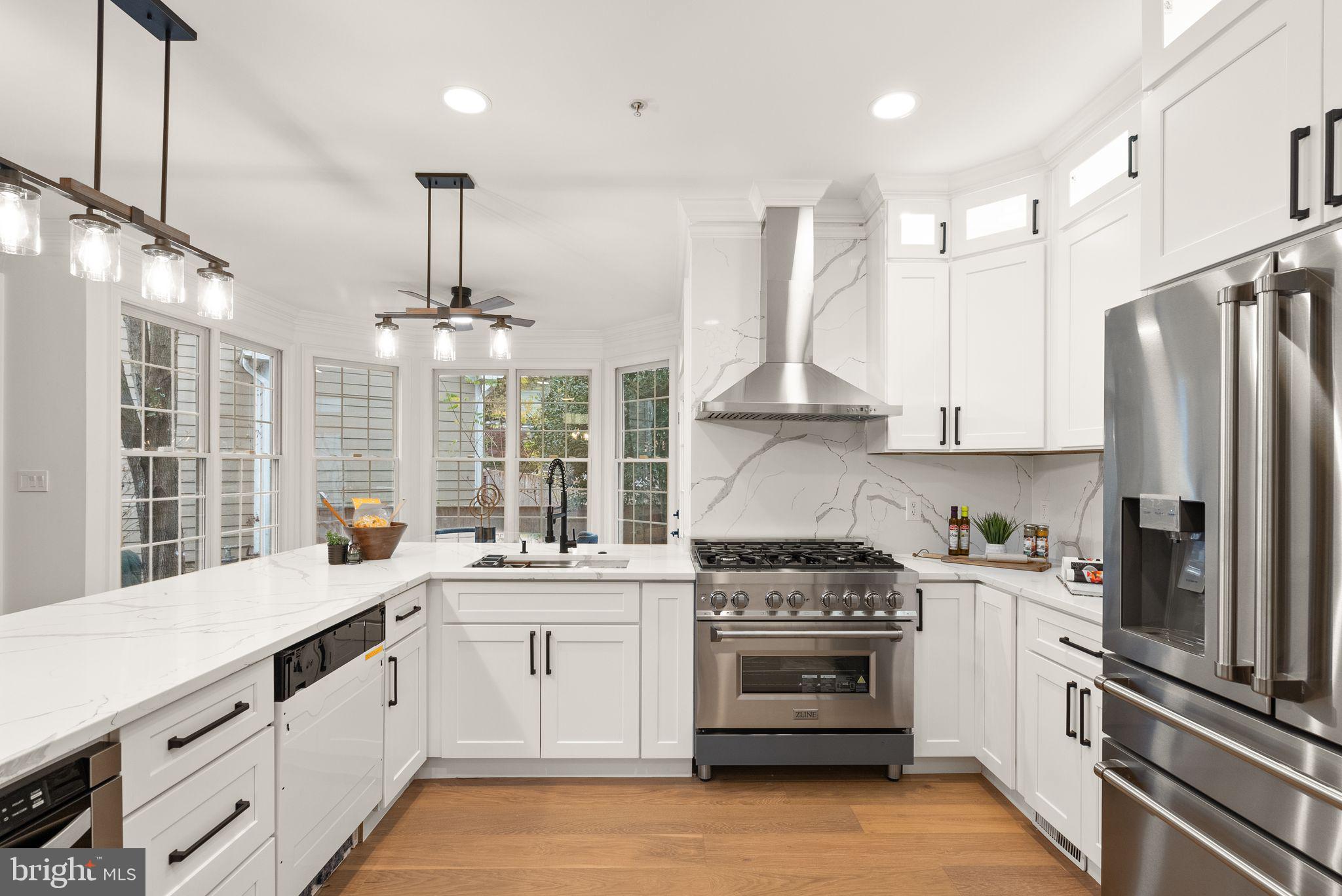 3336 Jones Bridge Court Chevy Chase, MD 20815 - Photo 33 of 99 a kitchen with a sink stainless steel appliances and window