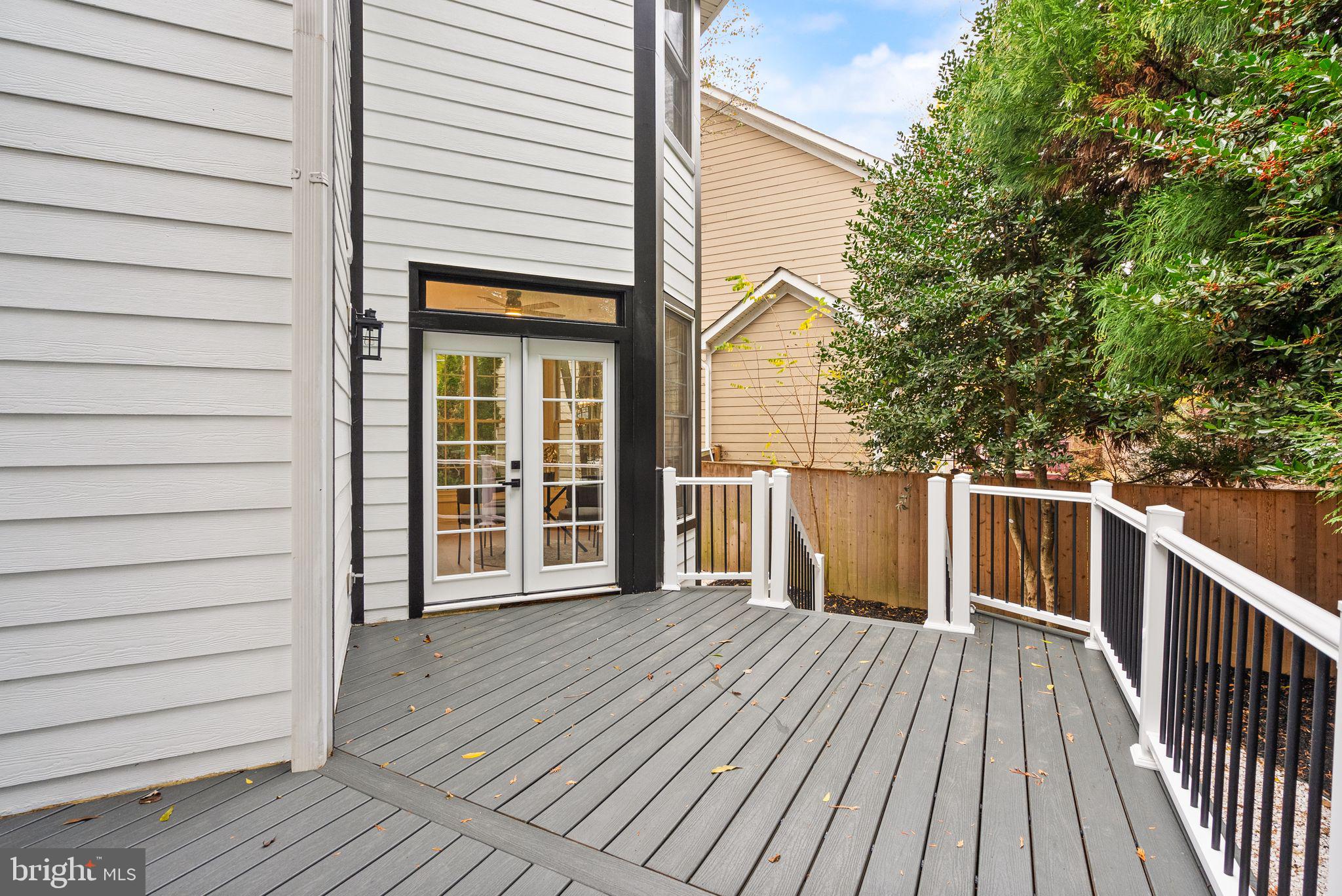3336 Jones Bridge Court Chevy Chase, MD 20815 - Photo 43 of 99 a view of a house with wooden deck