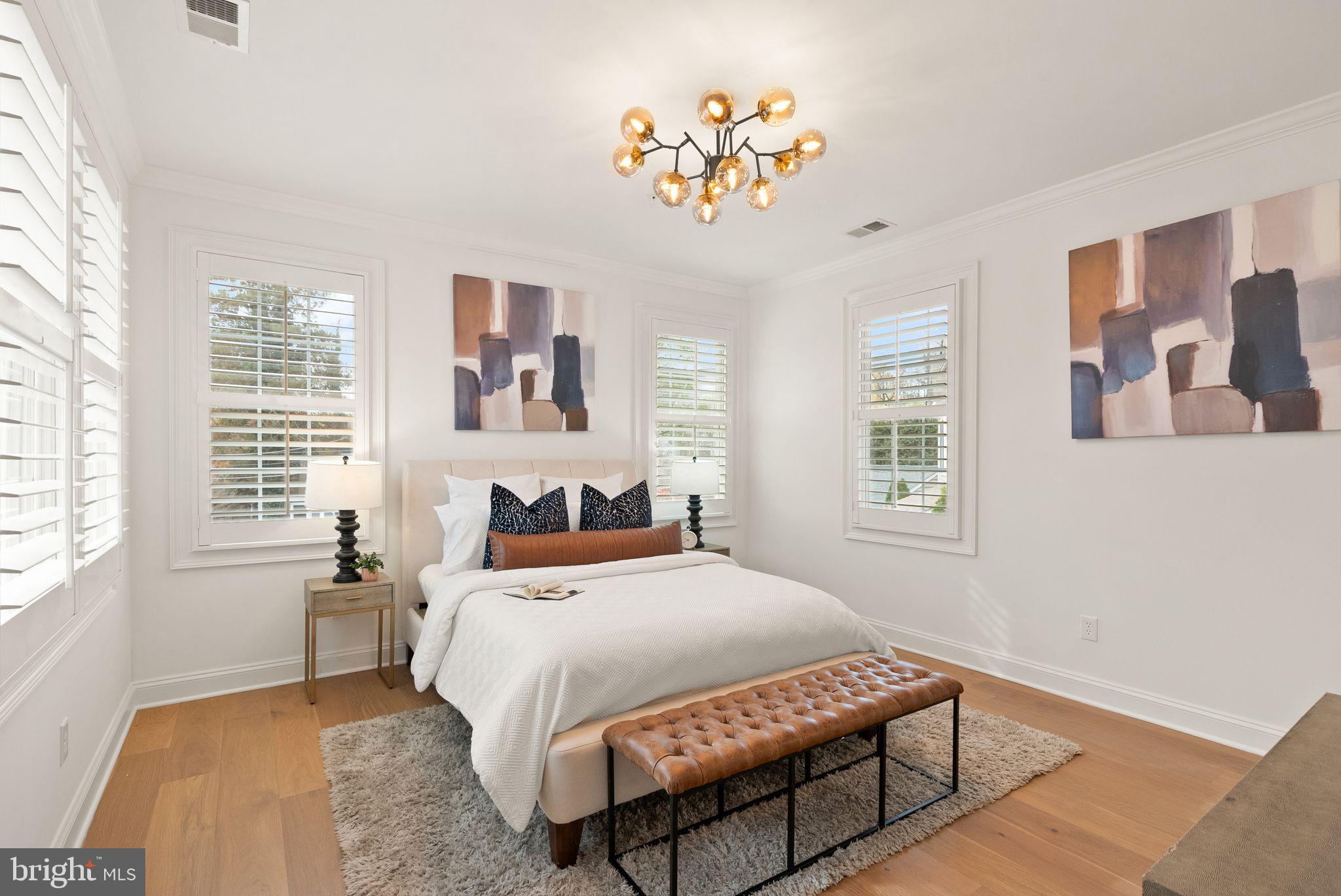 3336 Jones Bridge Court Chevy Chase, MD 20815 - Photo 49 of 99 a bedroom with a bed and a large window